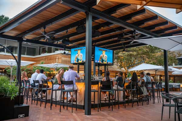 Stop by Cece's beautiful courtyard bar