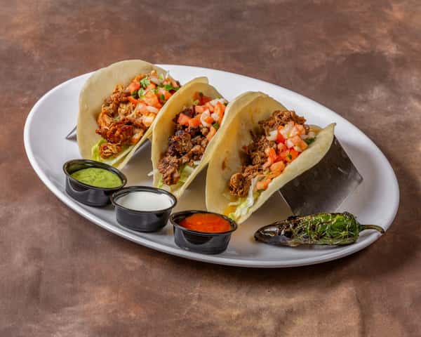 Carnitas Carne Asada And Barbacoa Tacos