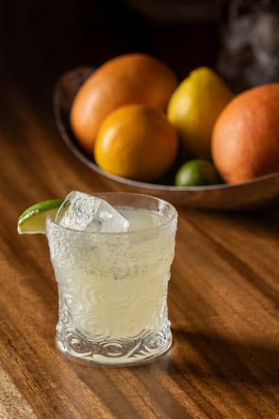 Classic cocktail rimmed with salt and lime slice