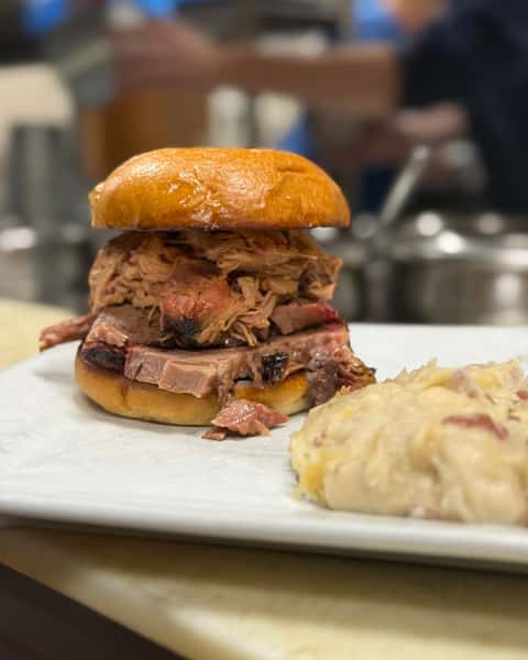 Can't decide on just one? Doubled Up Sandwich lets you choose 2 of our smoked meats—Brisket, Pork, or Sausage—all stacked on one sandwich. It's a customer favorite for a reason 😋🔥 #DoubleSSmokehouse #DoubledUpSandwich #SmokedMeats