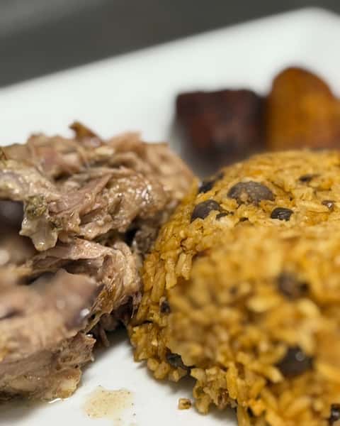 Saturday nights call for Dominican Roast Pork at Double S Smokehouse 😋 Pernil with arroz con gandules and maduros brings the perfect mix of savory, hearty, and sweet in every bite. No wonder Dominican Roast Pork is a customer favorite. 🔥 #DoubleSSmokehouse #DominicanRoastPork #CustomerFavorite