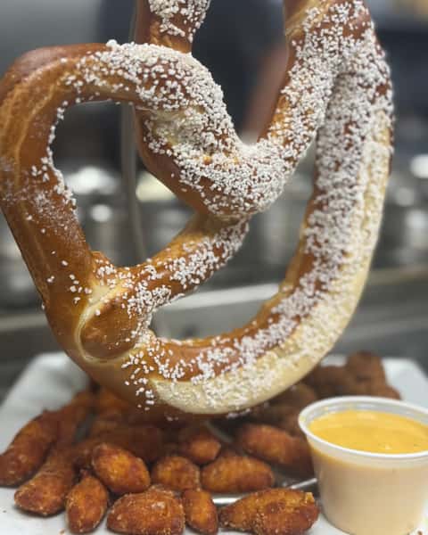 Customer favorite for a reason 😋 The Fried & Twisted Trio brings together a Bavarian Pretzel, Fried Pickles, and Fried Cheese Curd with Beer Cheddar Cheese and Spicy Ranch for the perfect mix of crispy, cheesy, tangy goodness. Come hungry for The Fried & Twisted Trio at Double S Smokehouse. #DoubleSSmokehouse #FriedAndTwistedTrio #AppetizerGoals #CustomerFavorite