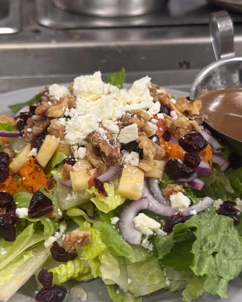 Fresh, crisp, and full of contrast, Autumn Salad brings together mixed greens, feta cheese, apples, walnuts, cranberries, and red onions for a bite that's bright, savory, and just a little sweet 🍎🥗 A great pick when you're craving something layered and satisfying at Double S Smokehouse. #DoubleSSmokehouse #AutumnSalad #FreshFlavors