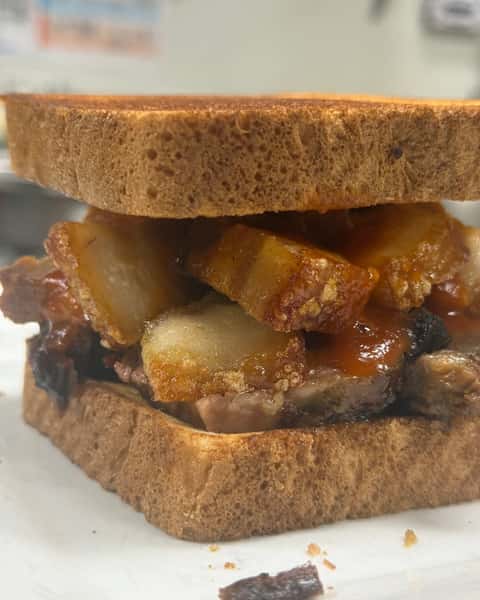 🔥 MEET THE BRISKET-RON! 🔥

We took BBQ to a whole new level. 😮‍💨

Our smoked brisket piled high with crispy chicharrón, pickled onions, and creamy coleslaw, all stacked on Texas toast and served with your choice of 1 side.

Smoky. Crunchy. Tangy. Messy in the BEST way. 🤘🔥

The Brisket-Ron has officially landed at Double S Smokehouse!

Who's coming to get one? 👀

#DoubleSSmokehouse #BrisketRon #SmokedBrisket #Chicharron #TexasToast #BBQ #Smokehouse #NewMenuItem #WarwickNY #BBQLove

Want it  more hardcore BBQ / badass or  more funny and attention-grabbing?