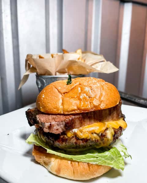 Texan Burger doesn't play nice. Stacked with brisket, drenched in BBQ sauce, and finished with cheddar cheese, it's the customer favorite for a reason. Want to sharpen the bite? Lettuce, tomato, and onion are available upon request. 🔥🍔 
#DoubleSSmokehouse #TexanBurger #BurgerObsession