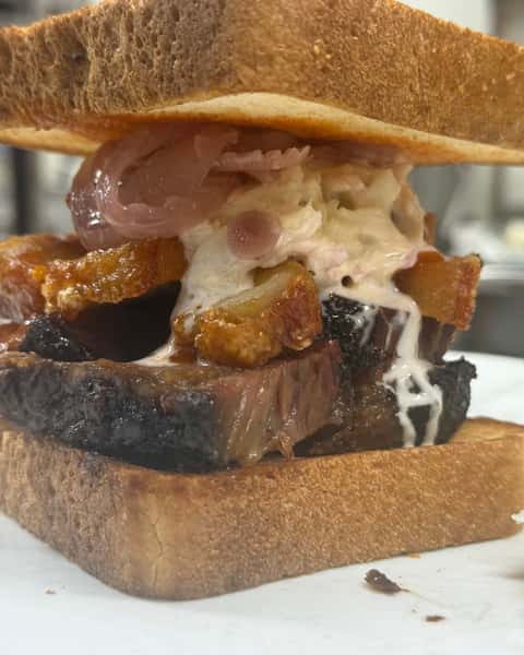 Meet the new Brisket-ron at Double S Smokehouse 🤤 Smoked Brisket brings the deep, savory flavor, Chiccharon adds the perfect crunch, and Pickled Onions, Cole Slaw, and Texas Toast round it out with tang, freshness, and comfort in every bite. #DoubleSSmokehouse #Brisketron #SmokedBrisket