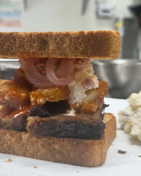 🔥 MEET THE BRISKET-RON! 🔥

We took BBQ to a whole new level. 😮‍💨

Our smoked brisket piled high with crispy chicharrón, pickled onions, and creamy coleslaw, all stacked on Texas toast and served with your choice of 1 side.

Smoky. Crunchy. Tangy. Messy in the BEST way. 🤘🔥

The Brisket-Ron has officially landed at Double S Smokehouse!

Who's coming to get one? 👀

#DoubleSSmokehouse #BrisketRon #SmokedBrisket #Chicharron #TexasToast #BBQ #Smokehouse #NewMenuItem #WarwickNY #BBQLove