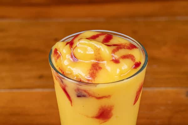 Creamy mango drink topped with mango sauce at Nara Cafe in Houston.