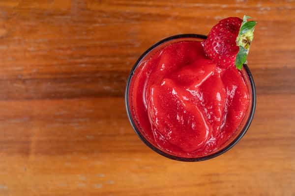 Mixed berry smoothie garnished with a fresh strawberry at Nara Cafe.