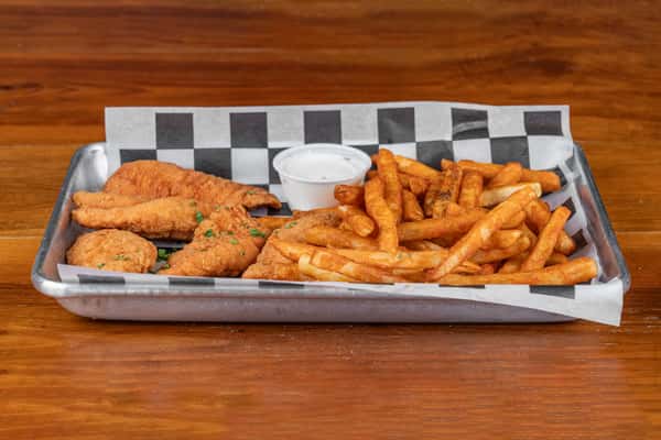 Crispy chicken tenders with seasoned fries and creamy dipping sauce.