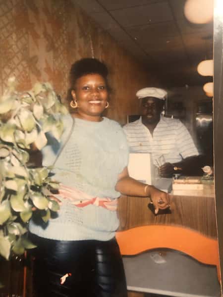 Old photo of two staff members in the restaurant