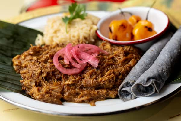 Pork with rice and pink onion