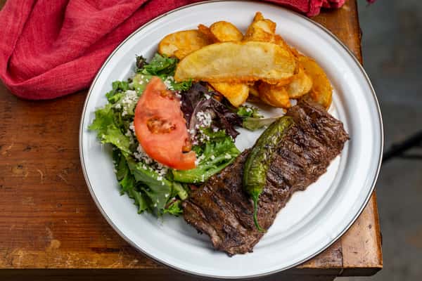 Steak and fries with salad