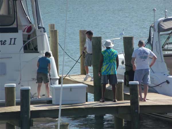 up close view of people standing on boat dock