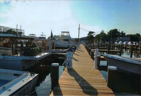 side view of boats tied to dock