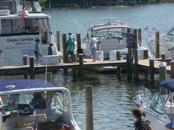 people standing on boat dock