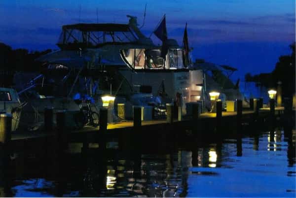 view of dock at night