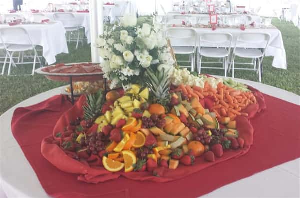 A round buffet with a variety of fresh fruit and vegetables