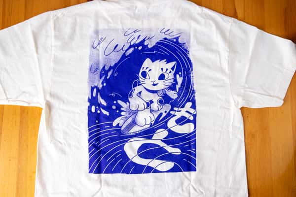 A t-shirt with Moto Ramen branded graphic art