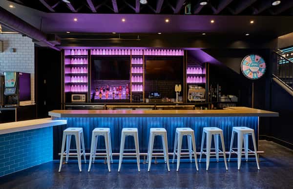 JoJo's Naperville's First Floor Bar lined with vintage LED milk bottles