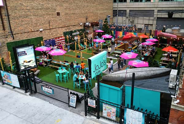 Camp JoJo's Patio in River North. With 17-foot canoes and games like cornhole and life-size beer pong, the patio is the perfect place for hanging out with friends & family