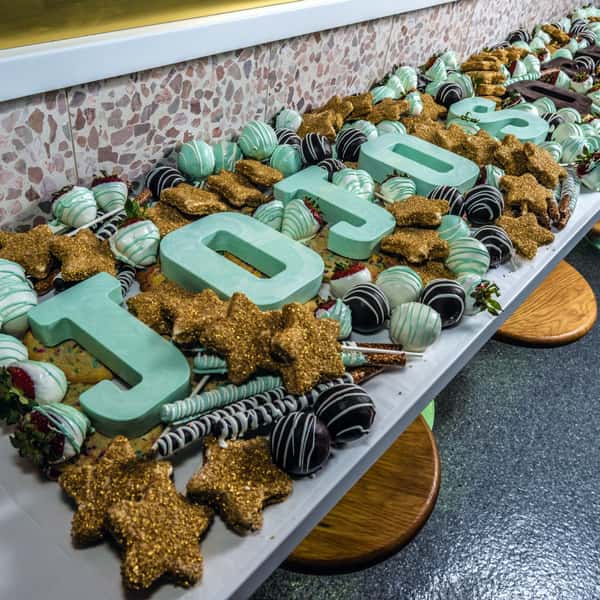 JoJo's Signature Sweets Table - perfect for any event, you can customize chocolate letters and provide your guests with delicious treats like star marshmallows, chocolate covered pretzels, chocolate covered donut holes and more!