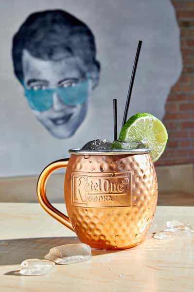 One of JoJo's Signature Cocktails - Ferris Mule...r - Kettle One Peach Blossom & Ginger Beer garnished with a lime