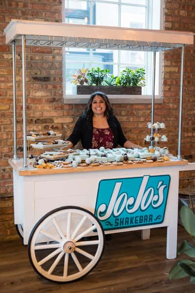 Introducing JoJo's Sweets cart! Perfect for birthdays, weddings, and baby showers, this customizable sweets table can be decorated to match your theme. Bring JoJo's delightful treats to your celebration, making it extra special with our unique and delectable offerings like chocolate letters and chocolate covered pretzels.