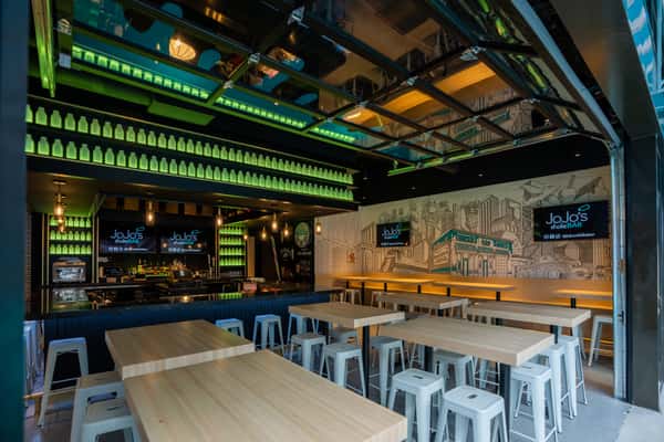 The open garage doors at JoJo's Detroit make for easy access to the large outdoor patio on Columbia Street
