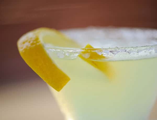 Lemon drop cocktail with sugar rim and lemon peel