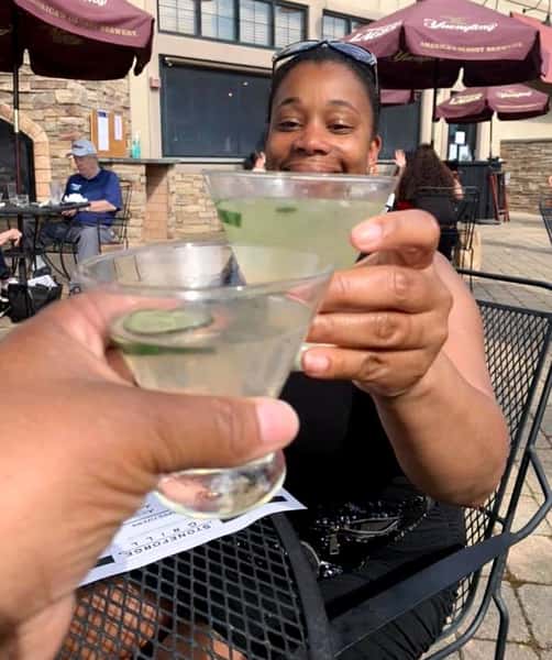 two ladies having cocktails in the patio