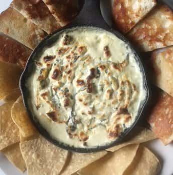 Dip in cast iron pan surrounded by chips