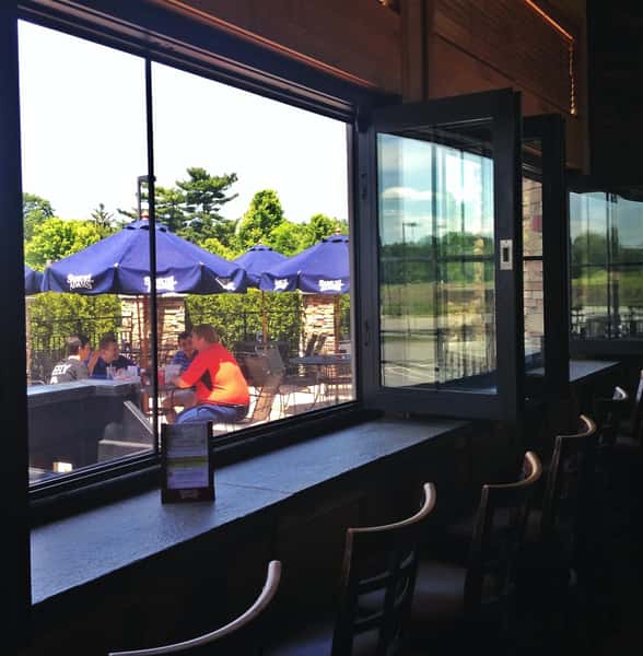 Wood bar with view of outdoor patio