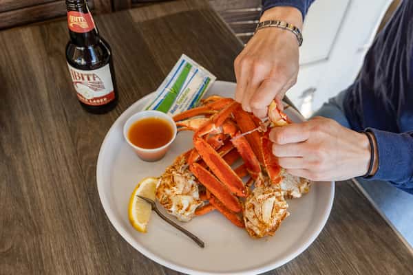 Hands cracking crabs