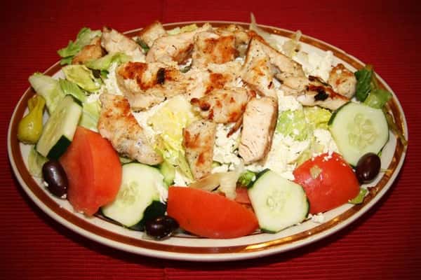 salad topped with grilled chicken