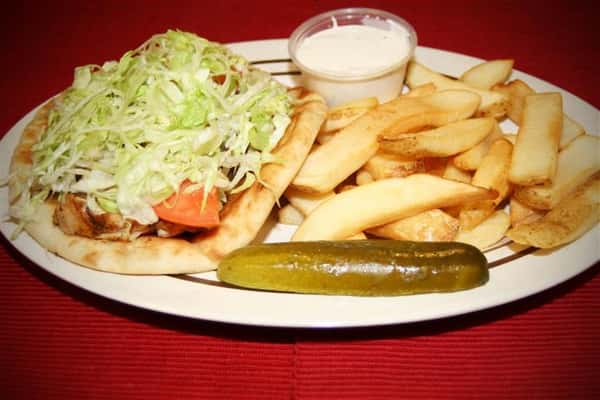 salad with fries and a pickle on the side