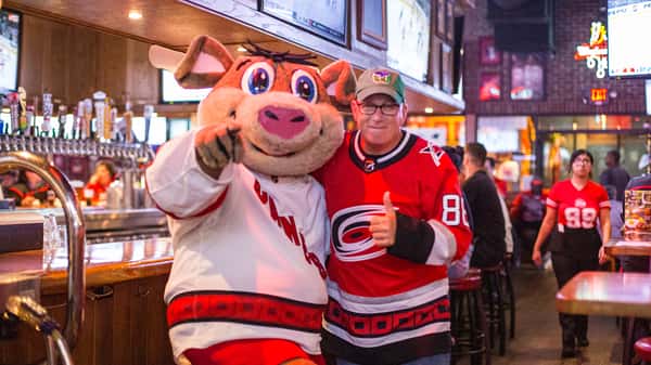 Carolina Hurricanes fan with Stormy at Carolina Ale House
