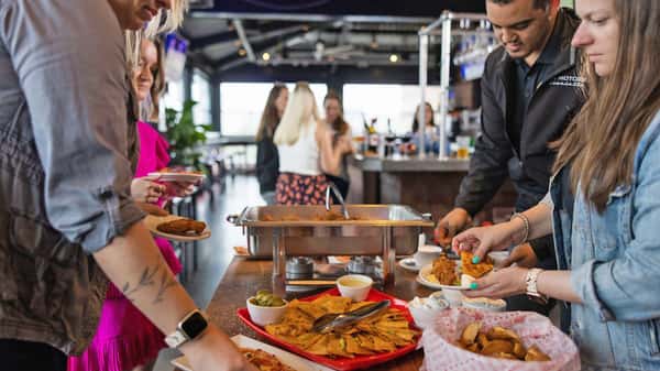 Guests enjoying catering during a reception at Carolina Ale House
