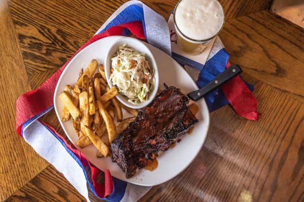 Picture of ribs, french fries, coleslaw, beer at Carolina Ale House