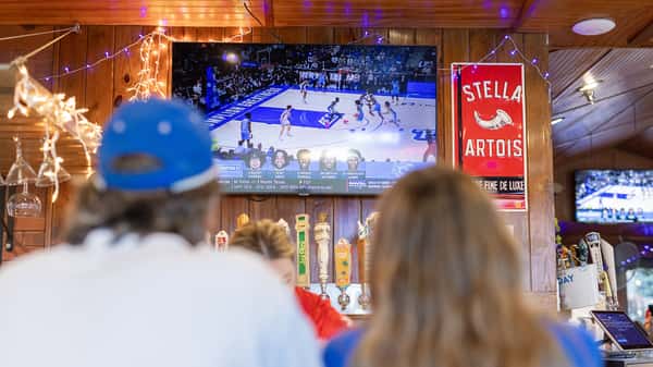 Friends at the bar watching Duke Basketball at Carolina Ale House