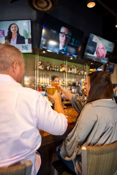 People enjoying time at bar.