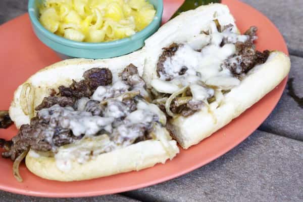 Sliced Steak "Wit" diced Onions and topped with White
American, Provolone Cheese OR Cheese "Whiz"
