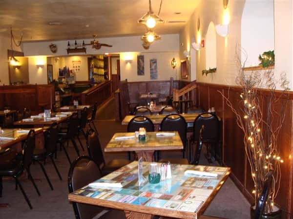 Dining area with chandeliers above