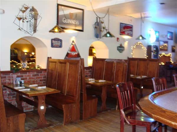 Dining area with framed beer signs on the wall