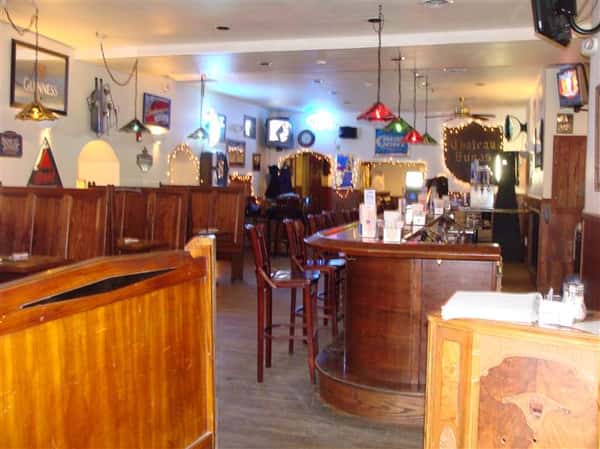 Bar stools and bar next to dining area