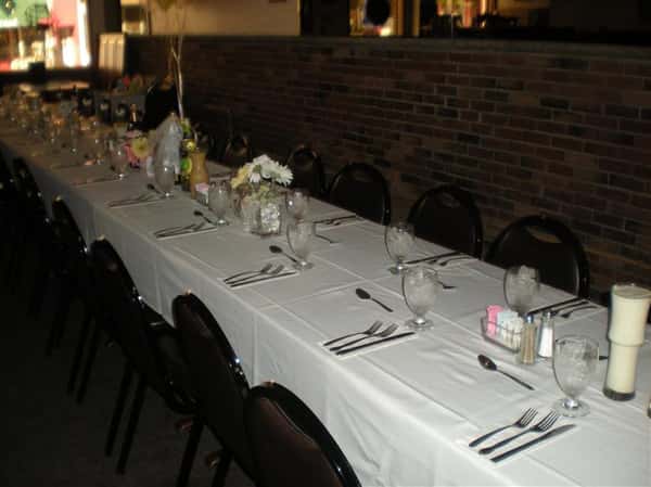 Table set up for a party. utensils set up in a uniform manner