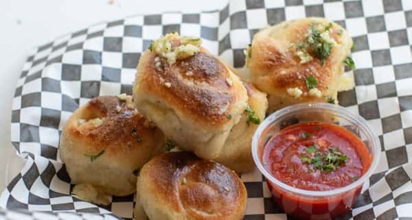 (5) New York Style Garlic Knots. Served with red sauce.