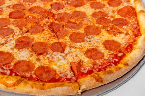 New York style pepperoni pizza with melted mozzarella and crispy crust, sliced and ready to serve