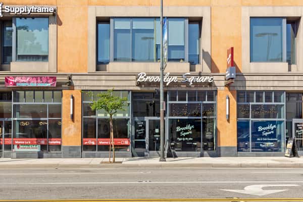 Brooklyn Square restaurant storefront with large windows and modern urban exterior on a city street