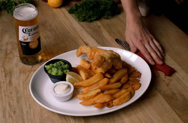 delicious-fish-and-chips-with-cold-beer-served-on-a-wooden-t-original